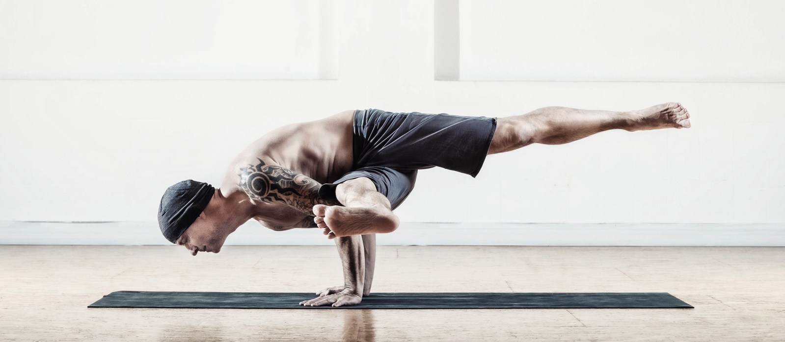 Andyji in Koundinyasana B at Antaratma Yoga Shala Innsbruck